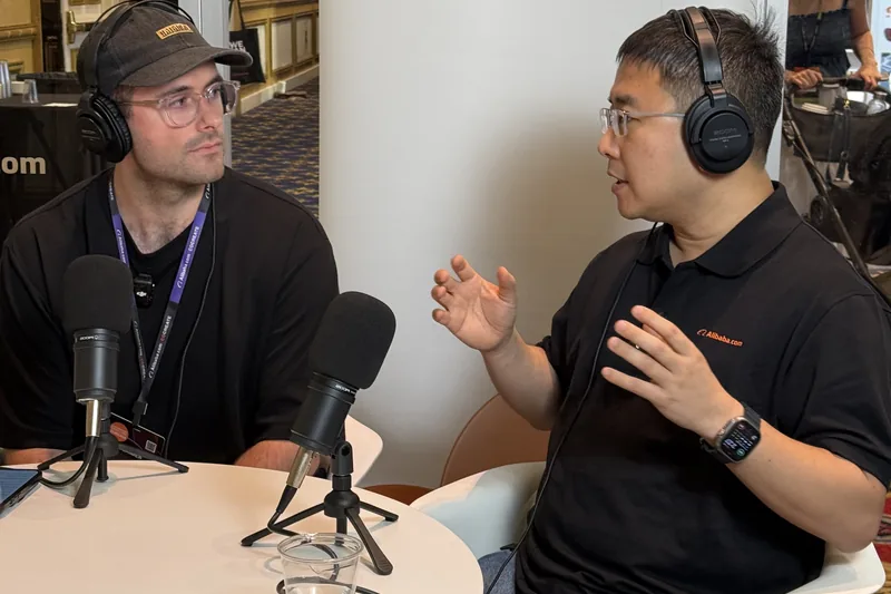 Adam Stewart interviewing an Alibaba.com executive at CoCreate 2025