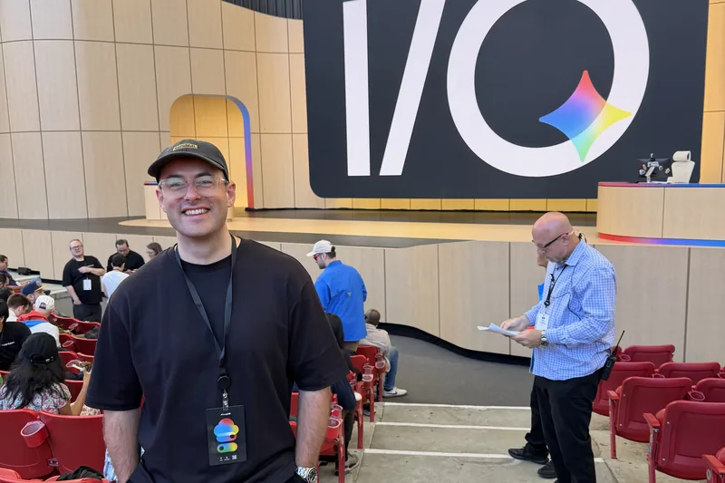 Adam Stewart at Google I/O in front of the I/O stage display